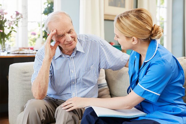 Community Nurse Visits Senior Man Suffering With Depression Community Nurse Visits Senior Man Suffering With Depression