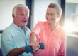 Senior couple exercising at home