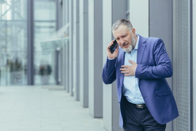 Senior gray haired man in business suit has severe chest pain, heart attack Heart Disease Management In Assisted Living In Dallas, TX