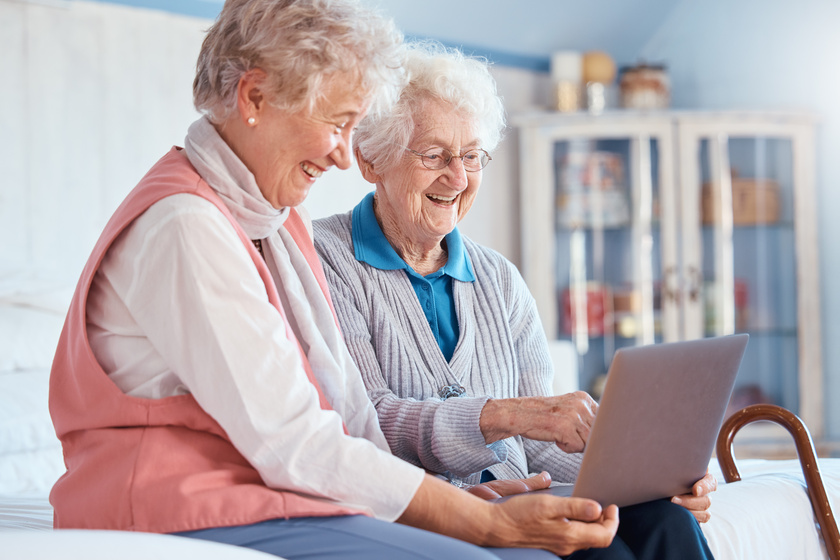 Senior women, friends and laptop in home for social media, watching movie or video call. Tech, computer and happy elderly retired females streaming video or internet browsing while talking together. Tips To Choose The Right Floor Plans In Bluff View, TX Assisted Living