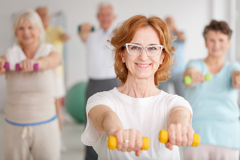 Lady exercising with dumbbells