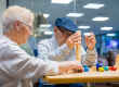 Pair of elder people in a nursing home playing skill games