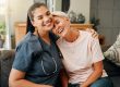 Senior woman, hug or medical caregiver