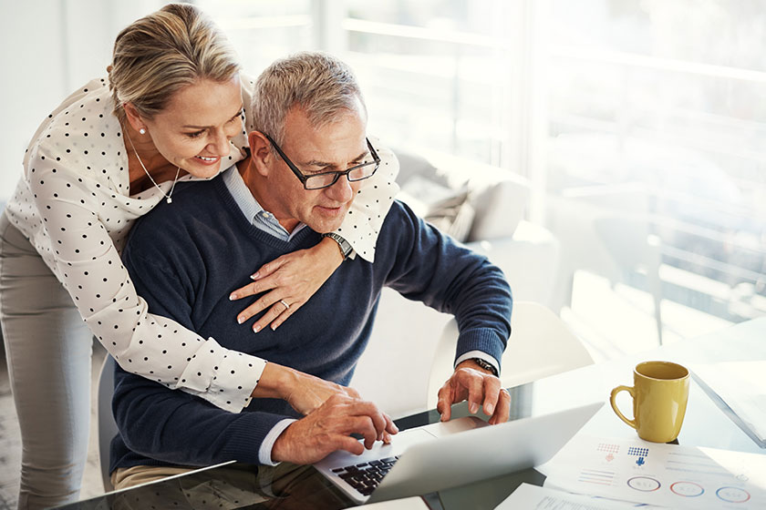 retired couple working on online side hustle in 2025