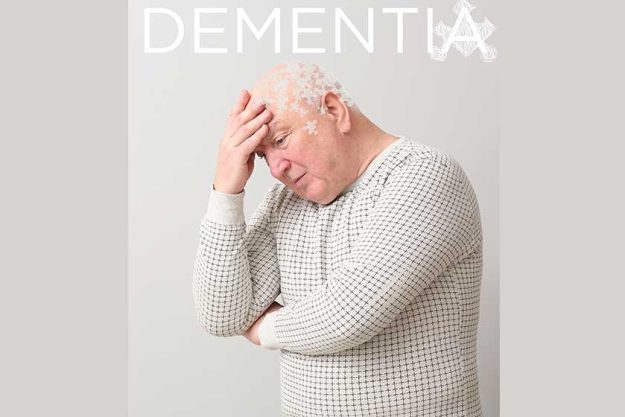 Elderly man suffering from mental disability on grey background Elderly man suffering from mental disability on grey background