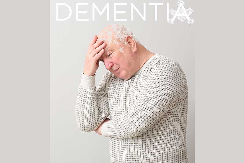 Elderly man suffering from mental disability on grey background
