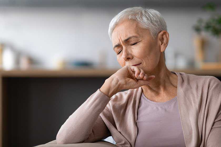 Exhaustion And Depression. Portrait of fatigued upset senior lady closing her eyes while sitting on sofa at home interior, suffering from headache and troubles, feeling depressed and lonely Exhaustion And Depression. Portrait of fatigued upset senior lady closing her eyes while sitting on sofa at home interior, suffering from headache and troubles, feeling depressed and lonely
