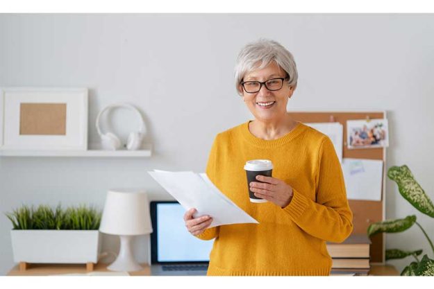 Happy-casual-senior-woman-working-in-home-office Happy-casual-senior-woman-working-in-home-office