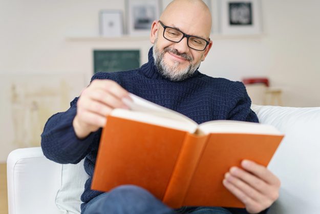 Middle-aged-man-enjoying-a-good-book