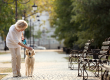senior-woman-walking-with-dog