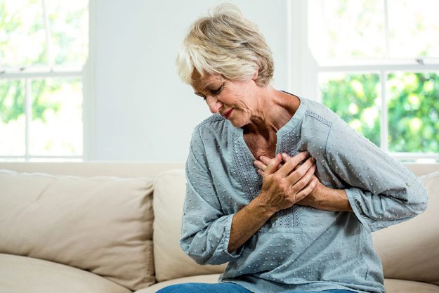 Woman suffering from chest pain Woman suffering from chest pain