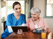 Tablet, consultation and nurse with senior woman