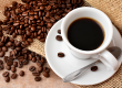 Cup of coffee and beans on the table